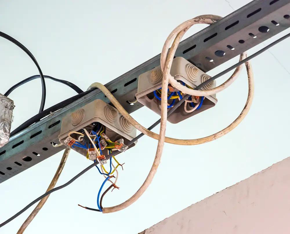 Uncovered junction boxes with exposed wiring and loose wire ends in Belleville, IL and the Metro East.