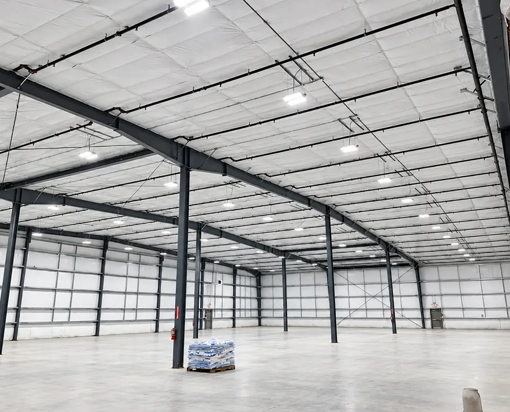 Overhead industrial lighting illuminating a large warehouse in Belleville, IL and the Metro East.